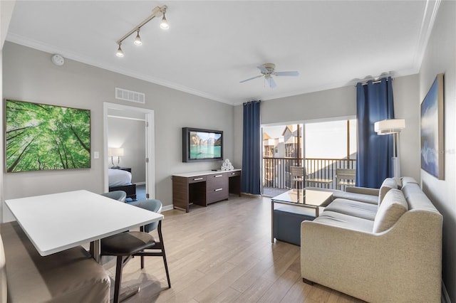 14501 Grove Resort Ave Unit 1727, Winter Garden, FL 34787 - living room featuring crown molding, light wood-type flooring, a ceiling fan, track lighting, and baseboards