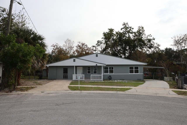 ranch-style house featuring a carport