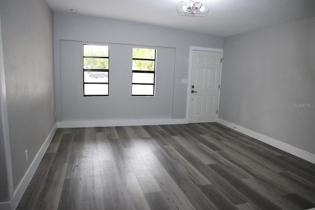 empty room featuring dark hardwood / wood-style floors