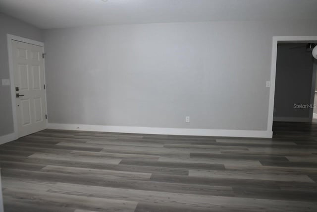 empty room featuring dark hardwood / wood-style floors