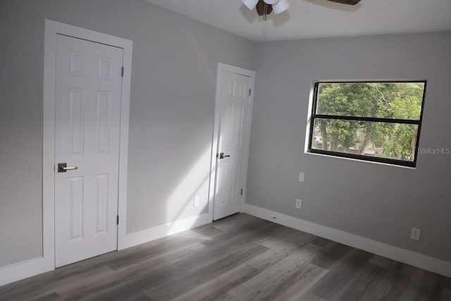 spare room featuring hardwood / wood-style floors and ceiling fan