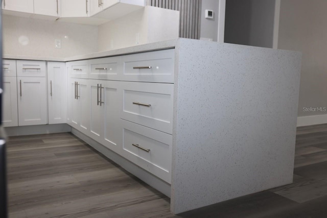 kitchen featuring white cabinetry and light hardwood / wood-style flooring