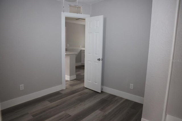 spare room featuring dark hardwood / wood-style floors