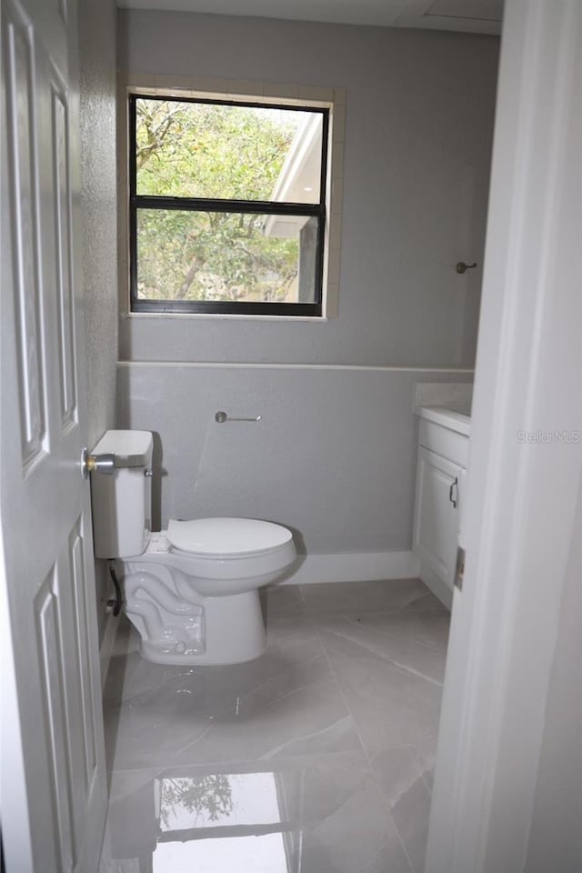 bathroom with vanity and toilet