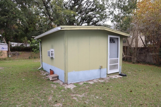 view of outbuilding with a yard