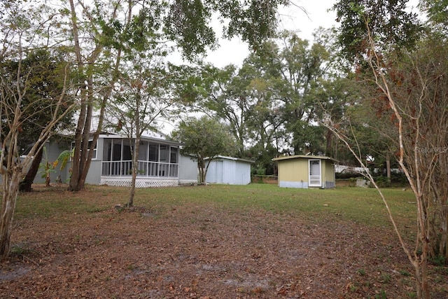 view of yard featuring a sunroom