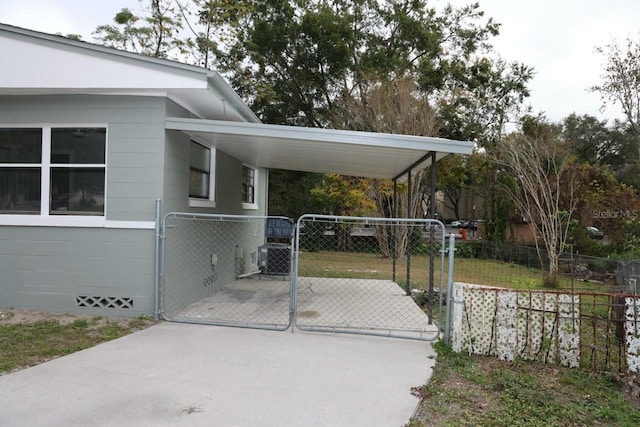 view of gate featuring a carport