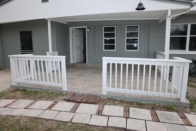 doorway to property featuring a porch