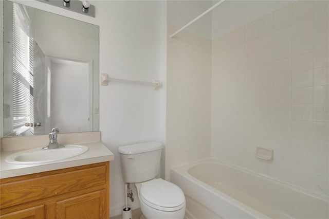 full bathroom featuring vanity, toilet, and tiled shower / bath