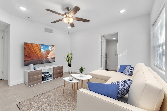 living room featuring ceiling fan and light tile patterned floors