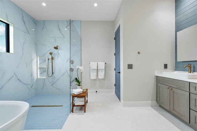 bathroom with vanity and independent shower and bath