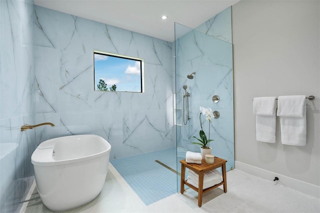 bathroom featuring tile patterned floors, tile walls, and shower with separate bathtub