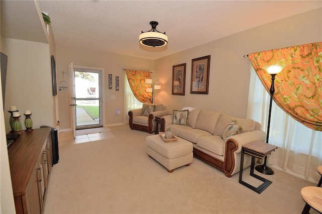 carpeted living room featuring a textured ceiling