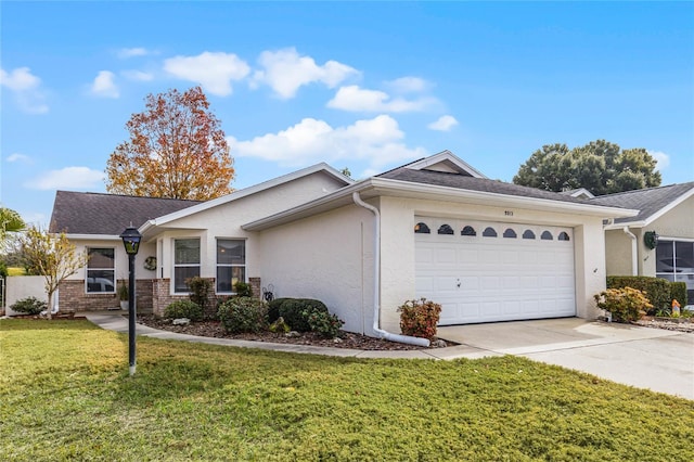 ranch-style home with a garage and a front yard