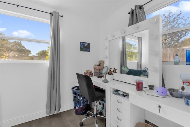 home office with dark hardwood / wood-style flooring