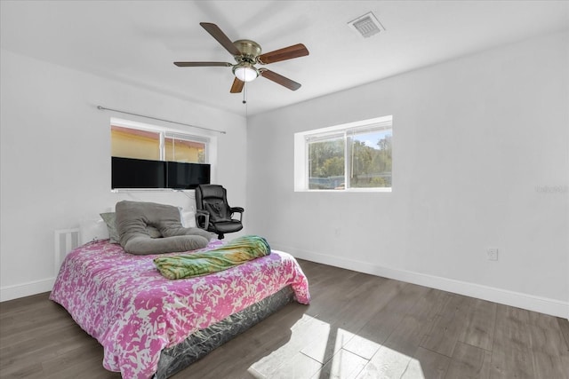 bedroom featuring dark wood-type flooring and ceiling fan