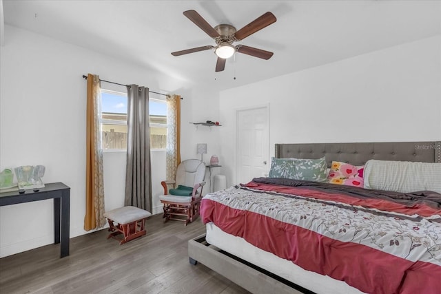 bedroom with hardwood / wood-style floors and ceiling fan