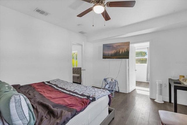 bedroom with dark wood-type flooring and ceiling fan