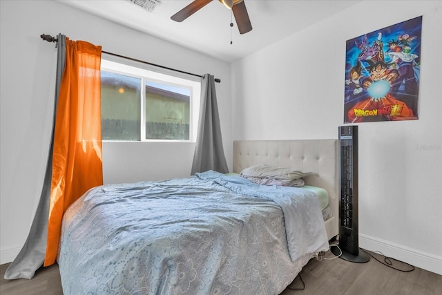 bedroom featuring wood-type flooring and ceiling fan