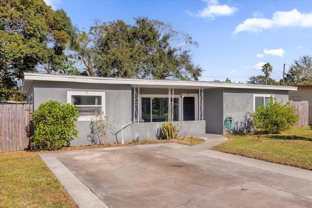 view of front of property with a front yard and a patio area