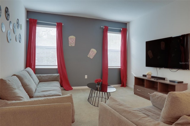 carpeted living room featuring plenty of natural light