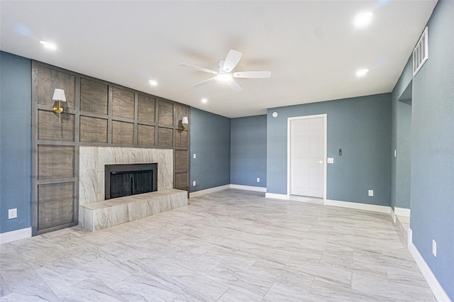 unfurnished living room featuring visible vents, baseboards, recessed lighting, a tiled fireplace, and a ceiling fan