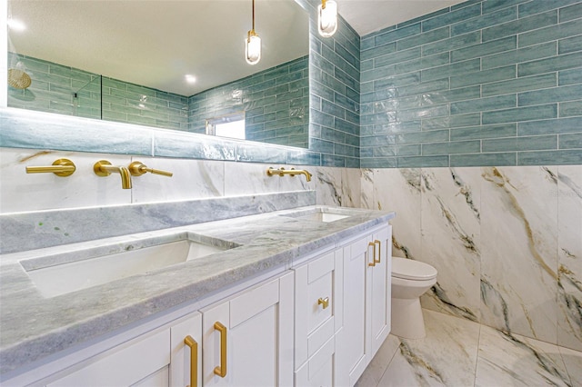 bathroom with toilet, tile walls, and a sink