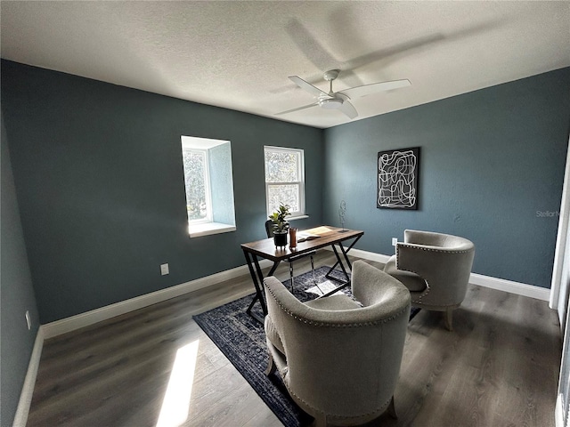 office with baseboards, ceiling fan, a textured ceiling, and wood finished floors