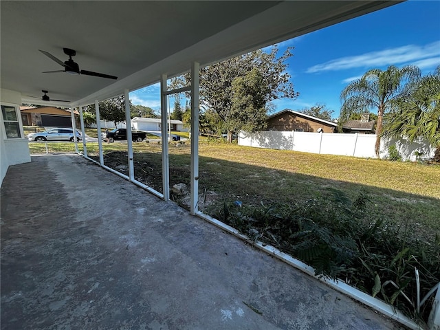 view of patio featuring fence and a ceiling fan
