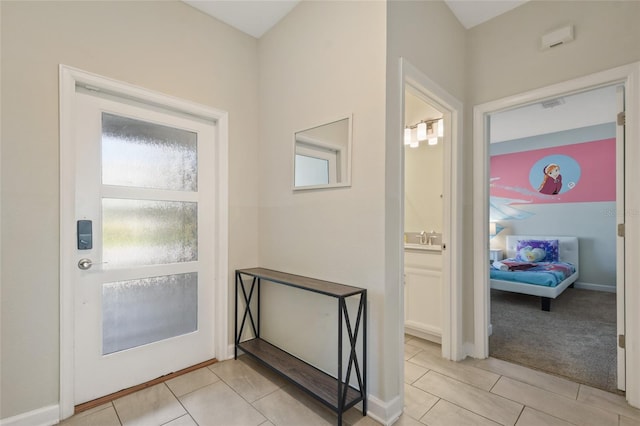 foyer with light tile patterned floors