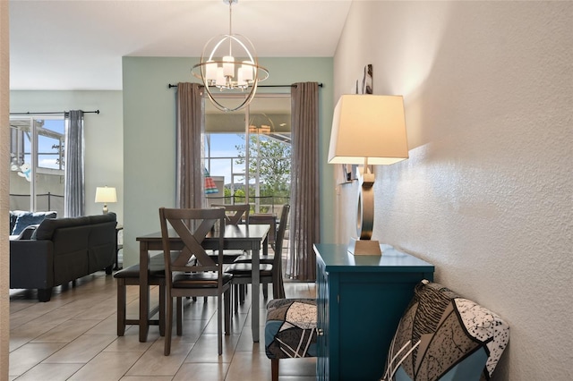 820 Pebble Beach Dr, Davenport, FL 33896 - dining room with a chandelier, light tile patterned floors, and a textured wall