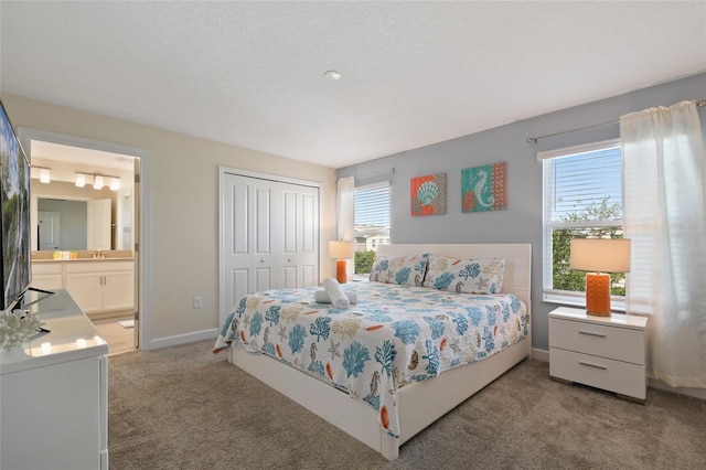 820 Pebble Beach Dr, Davenport, FL 33896 - bedroom featuring light colored carpet, a closet, and ensuite bathroom