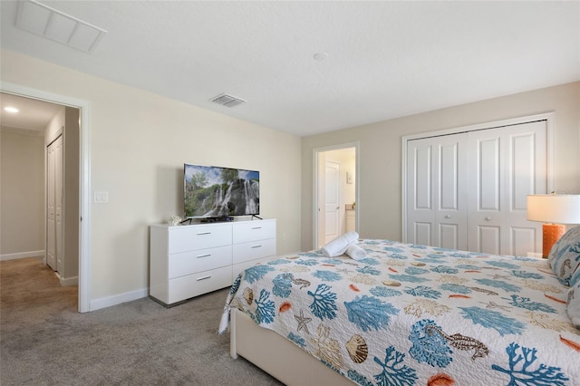 bedroom with light carpet and a closet