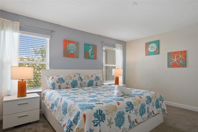 bedroom featuring dark colored carpet