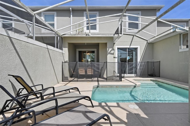 view of pool featuring a lanai and a patio