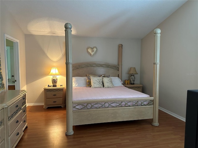 bedroom with hardwood / wood-style flooring