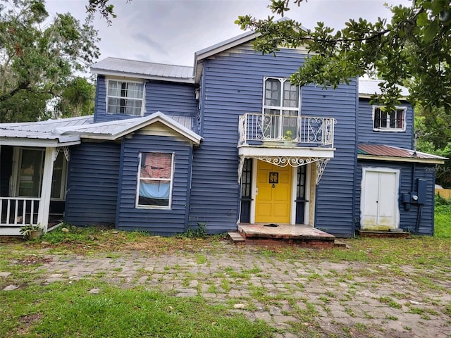 view of front of property with a balcony