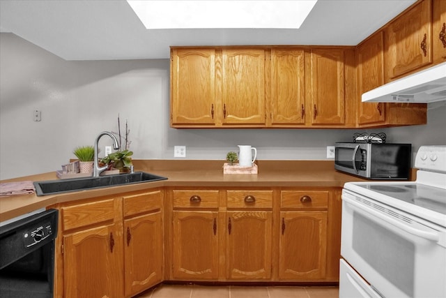 kitchen with a skylight, sink, light tile patterned floors, dishwasher, and white range with electric cooktop