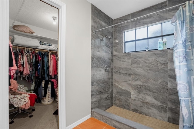 bathroom featuring tile patterned floors and curtained shower