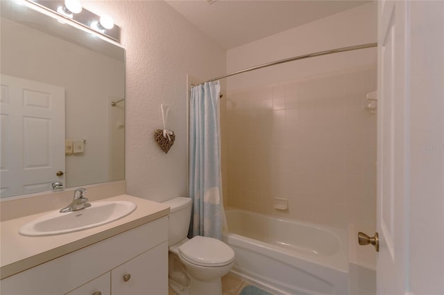 full bathroom with vanity, shower / bath combo, and toilet