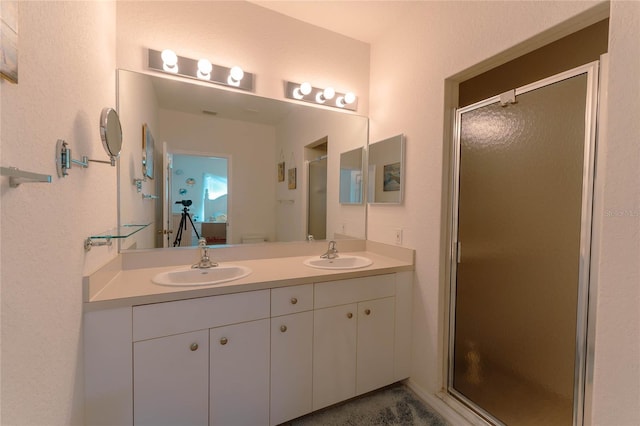 bathroom with vanity, toilet, and an enclosed shower