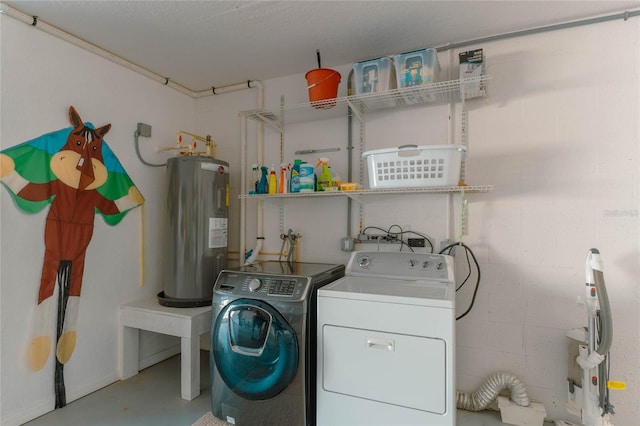 clothes washing area with washing machine and clothes dryer and electric water heater