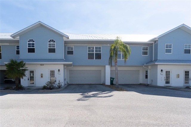 view of front of property featuring french doors and a garage