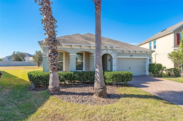 view of front facade with a front yard and a garage