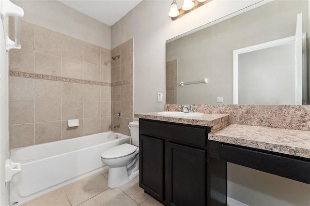 full bathroom with tile patterned flooring, vanity, toilet, and tiled shower / bath