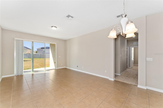 unfurnished room featuring light tile patterned floors and an inviting chandelier