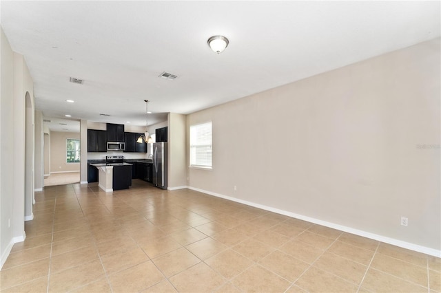 unfurnished living room featuring light tile patterned floors