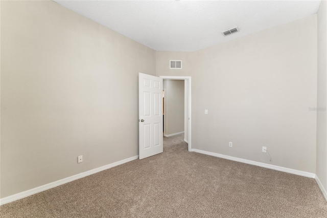 empty room featuring carpet flooring