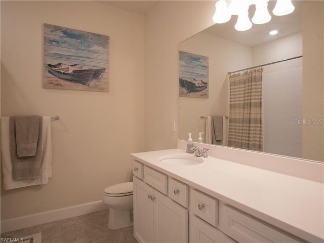 bathroom featuring tile patterned floors, vanity, toilet, and curtained shower