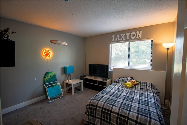 carpeted bedroom with a textured ceiling